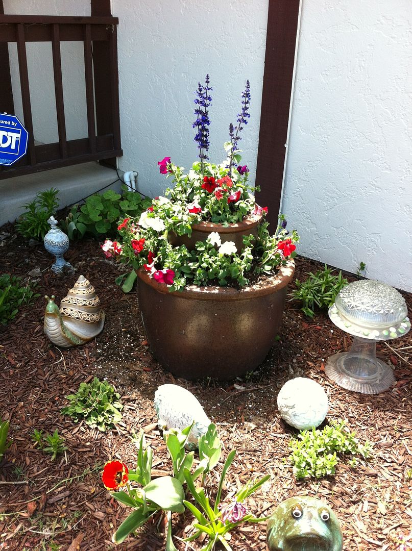Garden with beautiful flower containers
